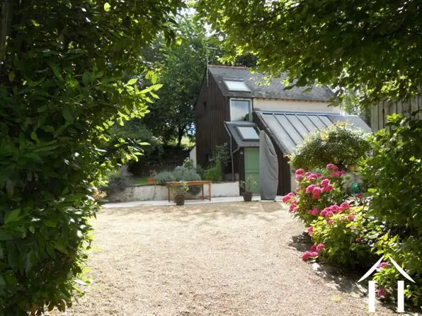 This is the modern style maison d'amis which could equally be used as a gîte. It is located at right angles to the main house and sits next to the large covered swimming pool.