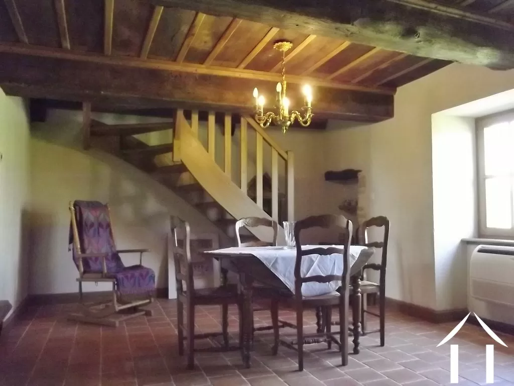 cosy dining room leading to second floor
