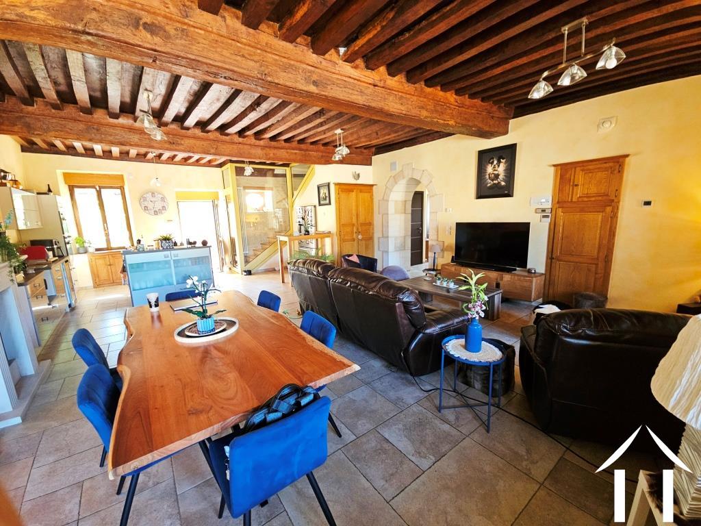Living room to kitchen and staircase