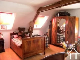 This shows the larger of the two bedrooms on the first floor