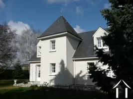 The house faces south and has garden to all sides of the property. It is secluded with trees and high hedges providing privacy