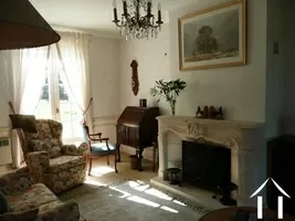 The lounge (with its feature fireplace) has windows to the front and rear. It is an L-shaped room with a large dining area.