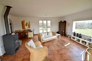 large living room of 44m2, with panoramic window dominating garden and view