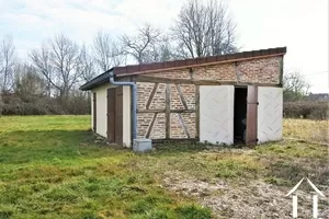 Outbuilding with garage and storeroom