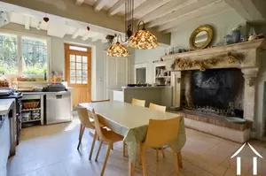 Kitchen with large fire place and access to the private garden