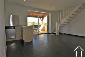living room with practical corner kitchen