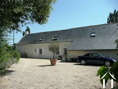 The gravel courtyard to the rear of the property - lots of room for car parking. 