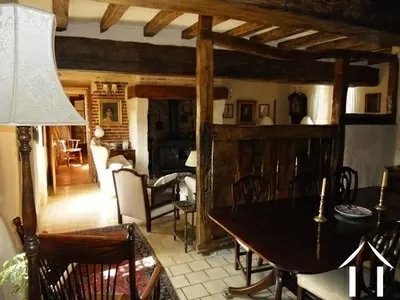 The lounge/dining room has a large feature fireplace, exposed stone walls, oak beams and lots of features. This room (over 40m2) also has the staircase which gives access to the first floor. Off this area is a downstairs WC and, separately, a double bedroom (with ensuite shower room). 
