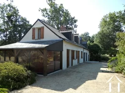 The house is classically styled with an ardoise slate roof and feature lucarnes (dormer windows). The house hs modern, hardwood double glazing throughout. In effect, the left side of the property (furthest in the picture) can be divided from the rest of the house to create a separate apartment/gîte) with its own access and terraces overlooking the garden. It has been renovated with this possibility in mind.