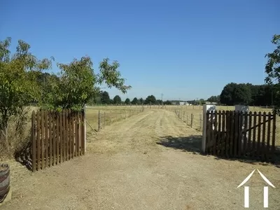 The approach is a long driveway that cuts through the 7.5 acres of ground that surround the house.