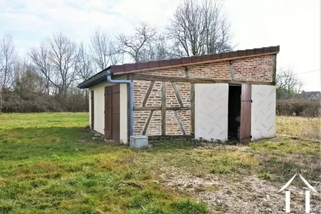 Outbuilding with garage and storeroom